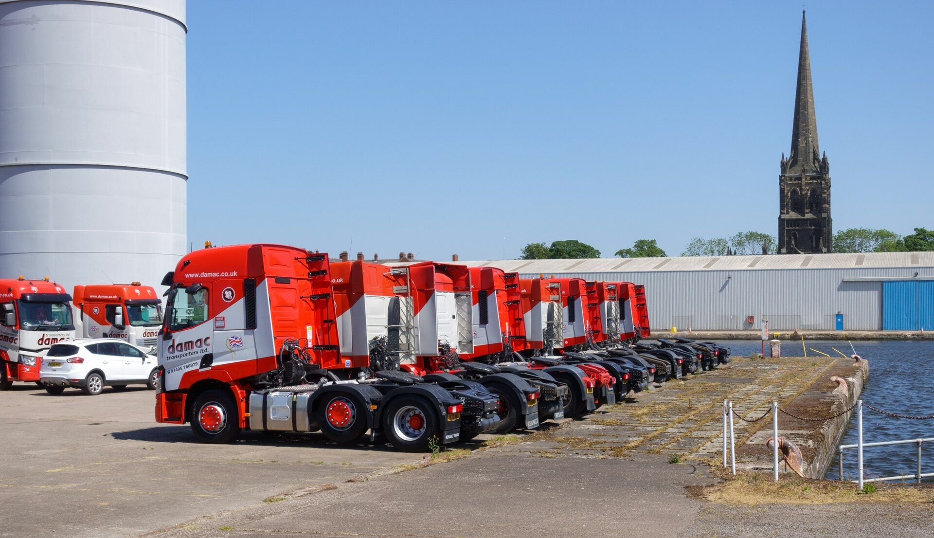 Row of tractor units parked without trailers at Stanhope Dock