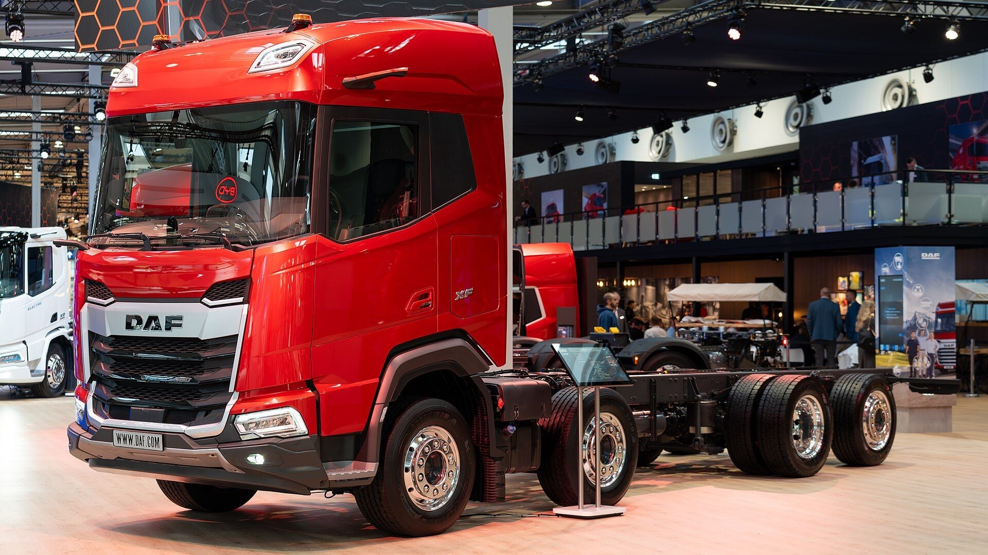 Red DAF XF 480 FAX four-axle rigid chassis with two front axles on the DAF stand at IAA Transportation 2024 in Hanover