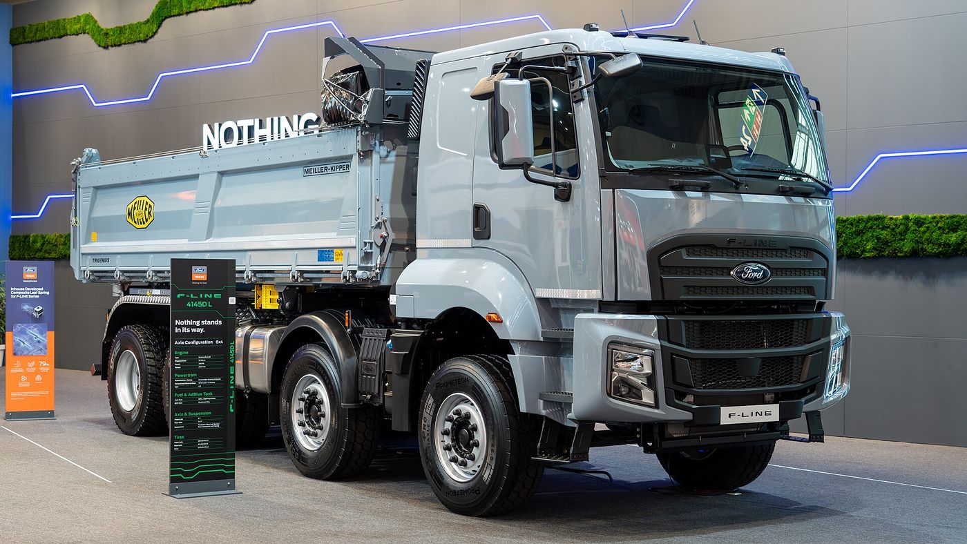 Grey Ford Trucks F-LINE 4145D L eight-wheel tipper with a day cab, two front axles and a Meiller tipper body, on the Ford Trucks stand at IAA Transportation 2024