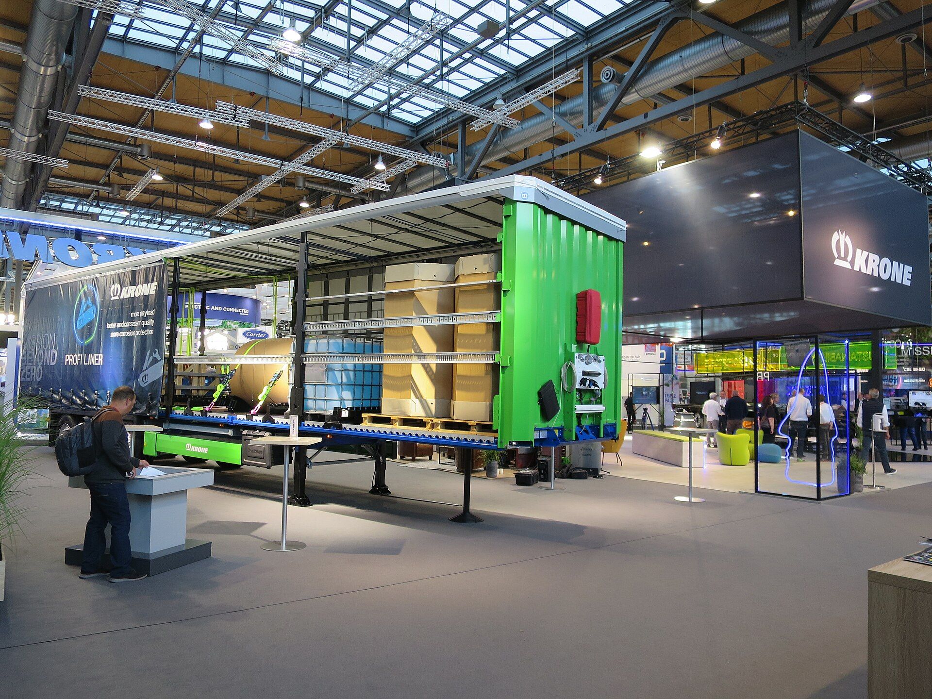 Krone Profi Liner curtainside semi-trailer with its side curtain drawn back over palletised freight, on the Krone stand at IAA Transportation 2022