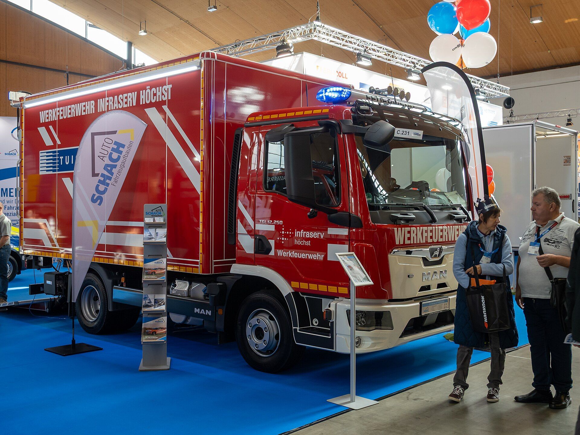 Roter MAN TGL 12.250 mit Kofferaufbau einer Werkfeuerwehr, auf einem Messestand der Nufam 2025 in Rheinstetten