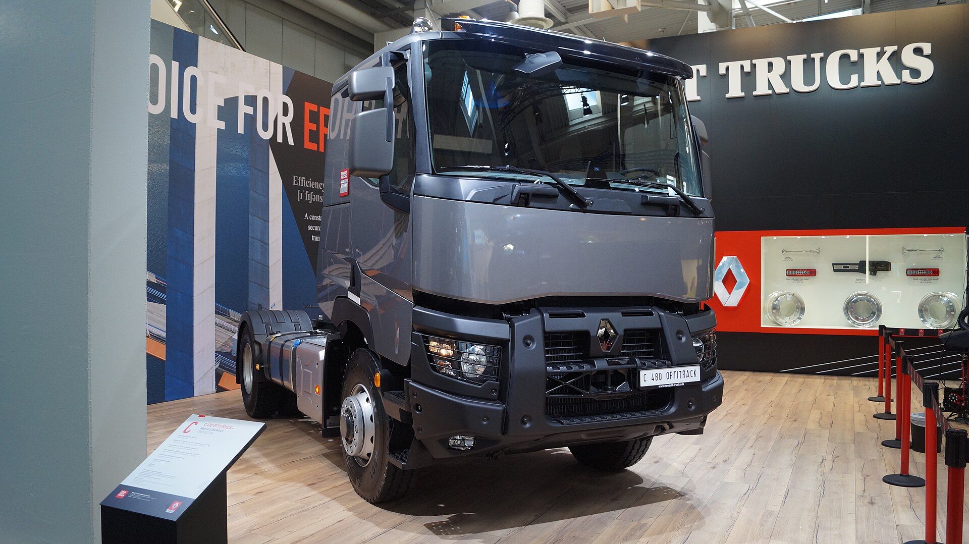 Grey Renault Trucks C 480 Optitrack two-axle tractor unit with the earlier front, larger headlamps behind grilles and a steel bumper carrying a C 480 OPTITRACK placard, on Renault Trucks' stand at IAA 2018