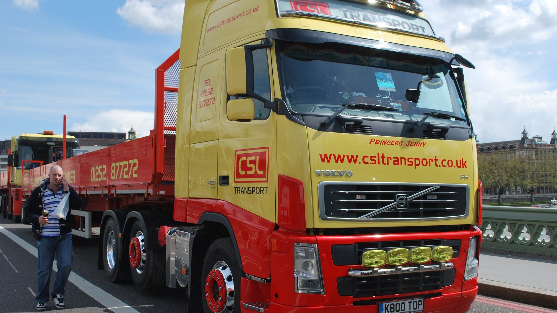 Volvo FH tractor unit in red and yellow livery